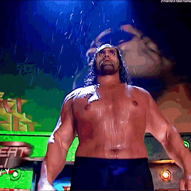 a man without a shirt is standing in the rain with the next thing written on the bottom right