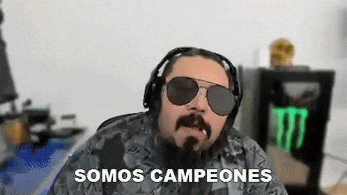 a man with a beard wearing sunglasses and headphones says " somos campeones "