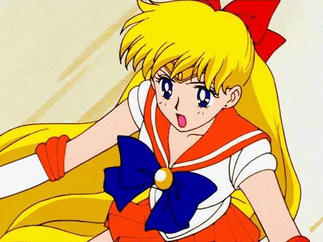 a cartoon girl with yellow hair and a red bow on her head