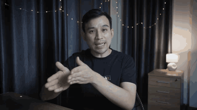 a man wearing a black t-shirt that says nike on it