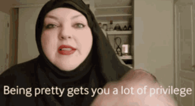 a woman in a black hijab says being pretty gets you a lot of privilege ..