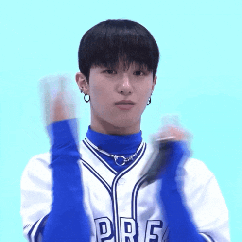 a young man wearing a blue and white jersey that says pre on it