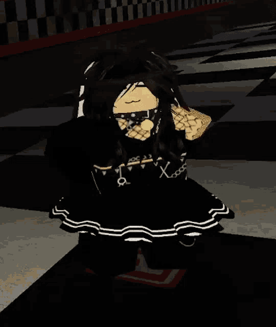 a girl in a black and white dress is standing on a checkered floor