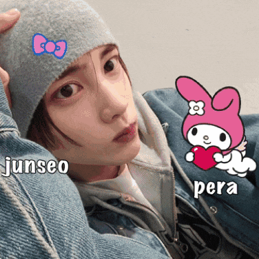 a girl wearing a beanie and a denim jacket with the words junseo and pera written on her face
