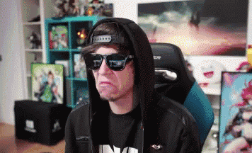 a man wearing sunglasses and a hoodie with the letter n on his shirt