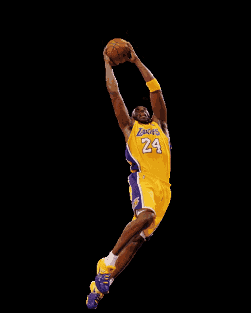 a basketball player in a lakers uniform is jumping in the air
