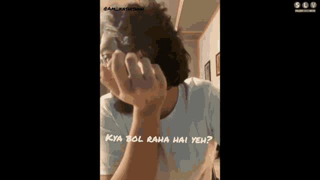 a man with glasses and a beard is making a funny face and the caption says kya bol raha hai yeh