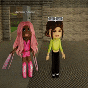 a girl with pink hair is standing next to another girl