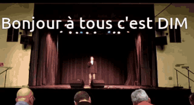 a woman singing on stage with the words bonjour a tous c'est dim