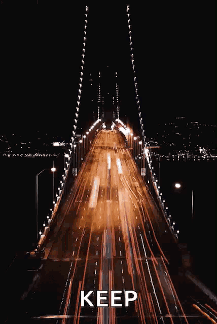 a picture of a bridge at night with the word keep above it