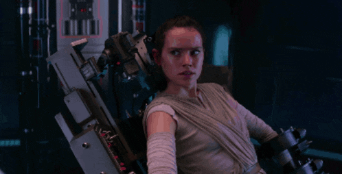 a woman is sitting in a chair with a machine attached to it