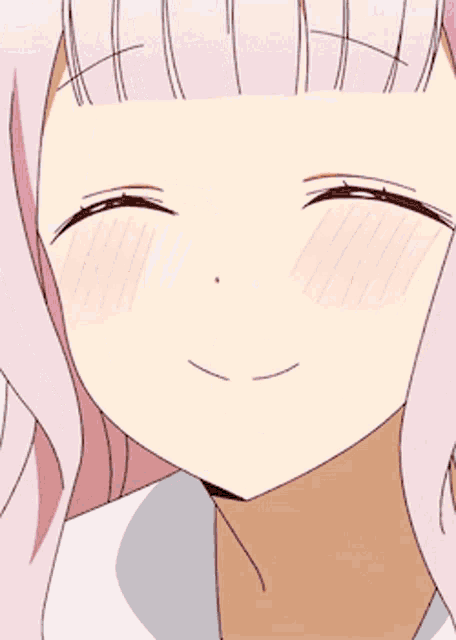 a close up of a girl 's face with pink hair