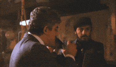 a man in a suit says " now go home & get your fuckin shine box "