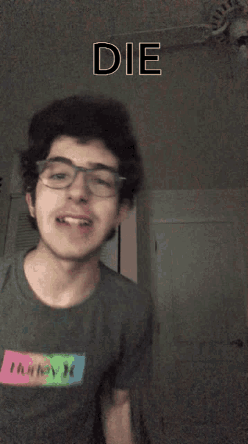 a man wearing glasses is making a funny face with the word die above his head