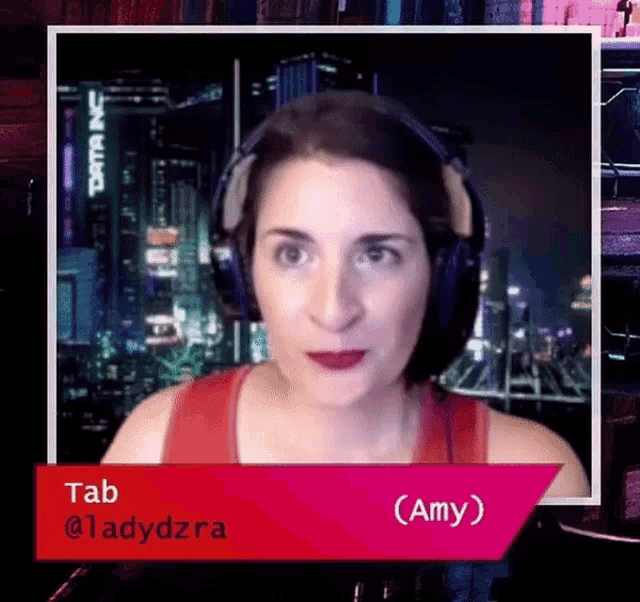 a woman wearing headphones and a red tank top with the name amy