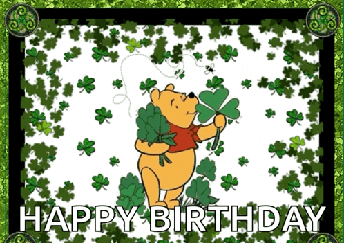 a birthday card with winnie the pooh holding a shamrock