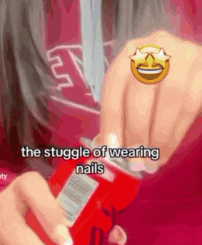 a woman is wearing a ring on her finger while holding a can of soda ..