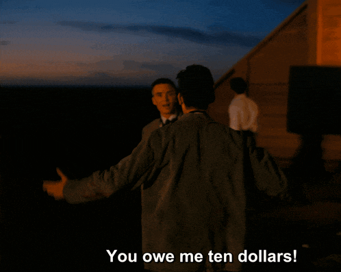 a man is hugging another man with the words you owe me ten dollars below him