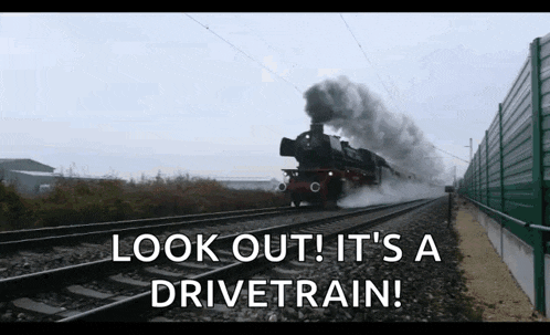 a train is going down the tracks and the words look out it 's a drivetrain