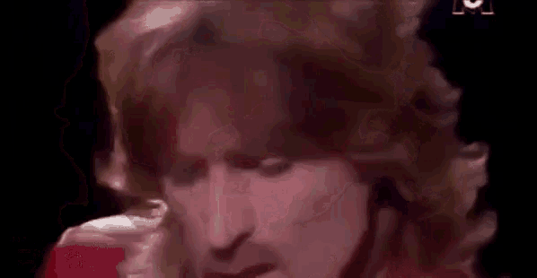 a close up of a man 's face with the words `` et j'ai crie '' written on it .