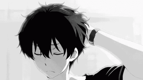 a black and white photo of a boy with his eyes closed .