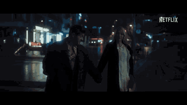 a man and a woman are walking down a street with a netflix logo in the background