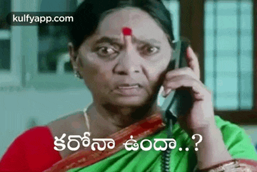 a woman is talking on a cell phone in a foreign language and making a funny face .