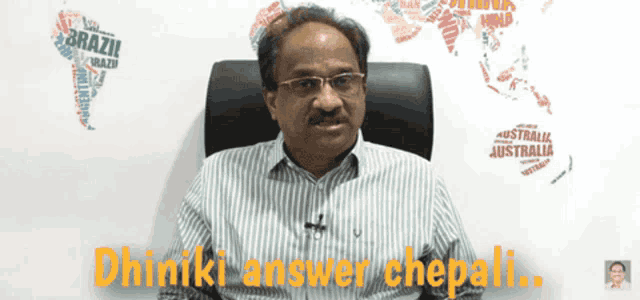 a man is sitting in front of a wall with a map of the world and the words dhinki answer chepali