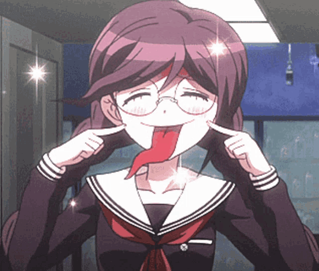 a girl with glasses is sticking out her tongue and making a funny face