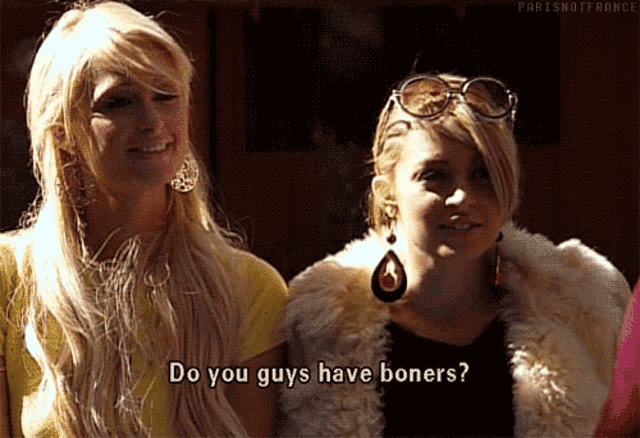 two blonde women are standing next to each other and one of them is asking the other if they have boners