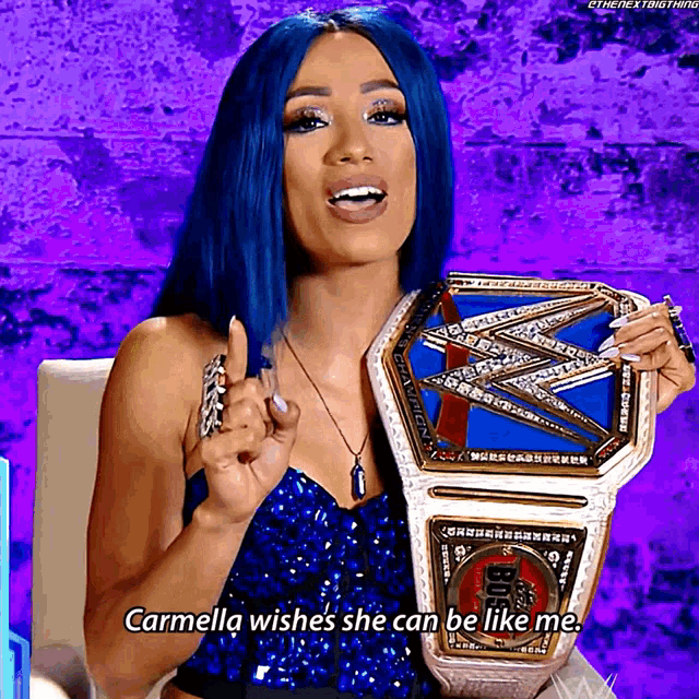 carmella wishes she can be like me while holding a wrestling championship belt