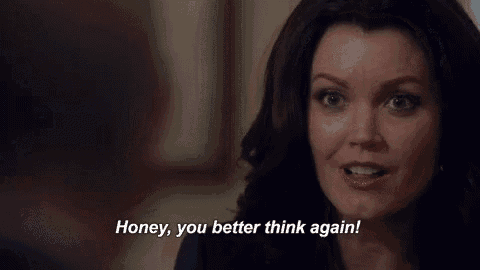 a woman is smiling while talking to a man and saying `` honey , you better think again ! ''