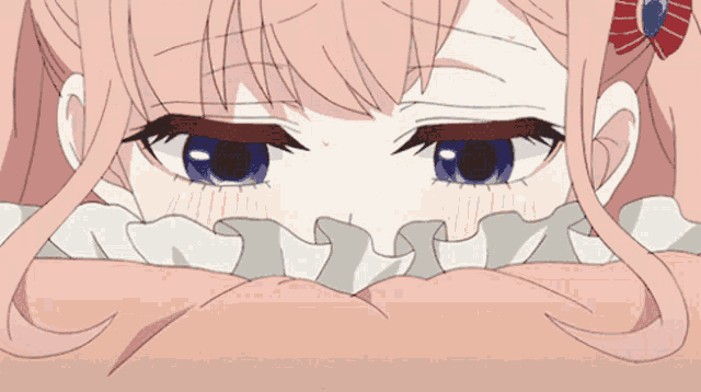 a close up of a girl 's eyes with pink hair and blue eyes