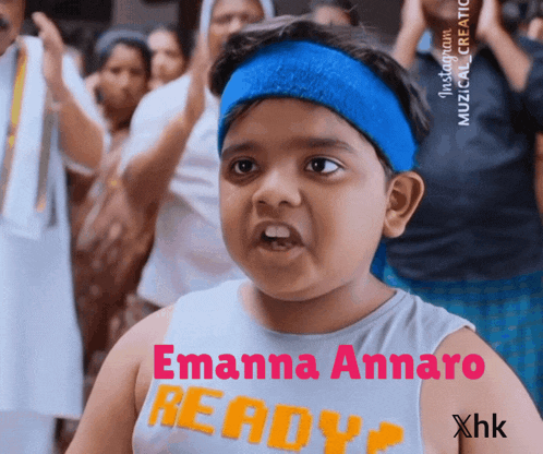 a boy wearing a headband and a shirt that says emanna annaro ready