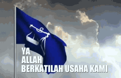 a blue flag is waving in the wind with a cloudy sky behind it