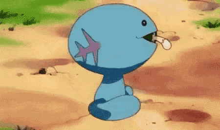 a blue cartoon character is sitting on a dirt road with its tongue out .