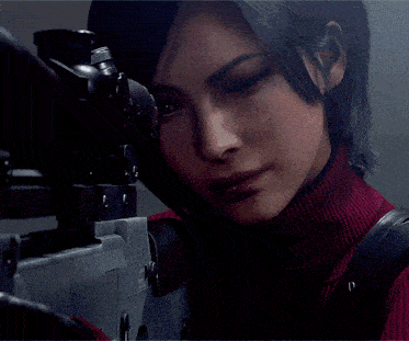 a woman in a red sweater is holding a sniper rifle and looking at it