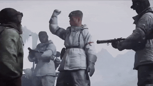 a man in a white coat is holding a gun with a red cross on it