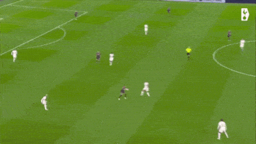 a blurry picture of a soccer player in a white shirt