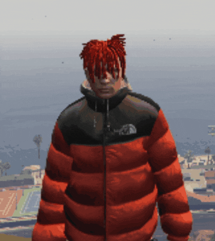 a man with dreadlocks is wearing a red north face jacket