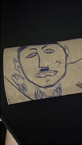 a drawing of a man 's face with a fork in his mouth