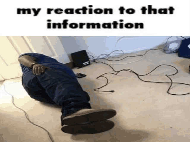 a man is laying on the floor in a room with a lot of wires around him .