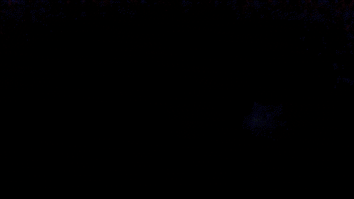 a dark background with a few white dots on it