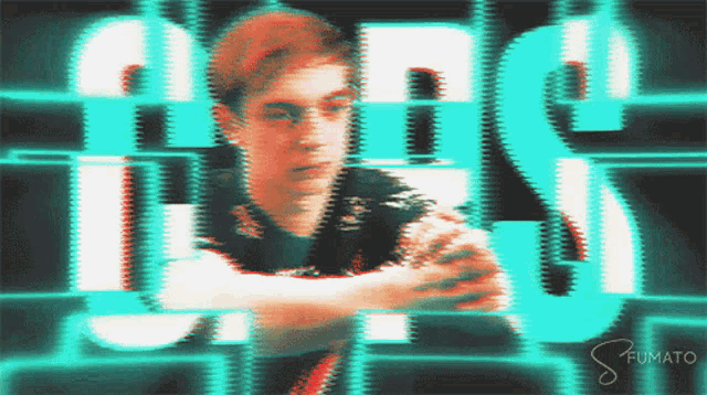 a blurry picture of a man with the words aes written behind him