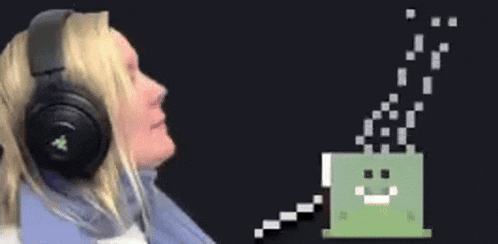 a woman wearing headphones is sitting in front of a pixelated image of a person .
