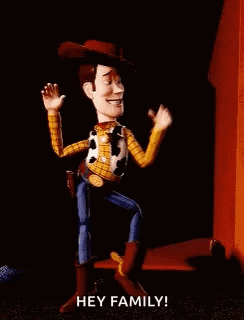 woody from toy story is dancing and pointing at the camera .