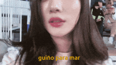 a close up of a woman 's face with guino para mar written in yellow