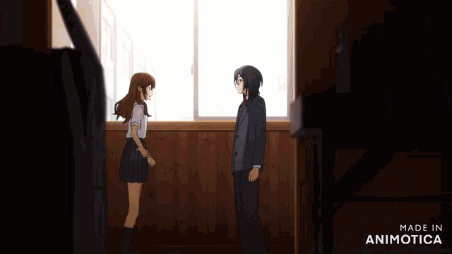 a man and a woman are looking at each other and the words made in animotica are visible