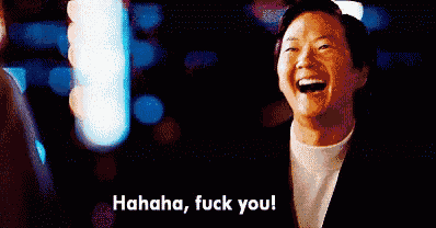 a man in a suit is laughing and saying , ' hahaha , fuck you ! '