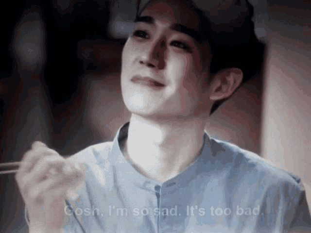 a man in a blue shirt is crying with the words " i 'm so sad it 's too bad " below him